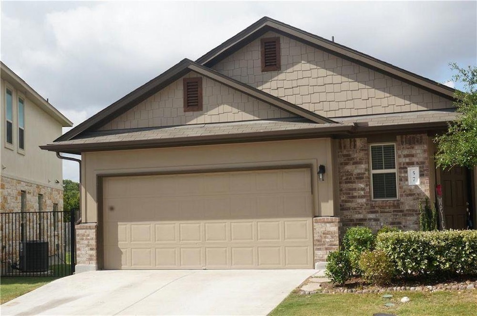 Craftsman house featuring driveway and an attache