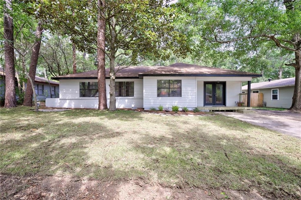 Ranch-style home with a front yard