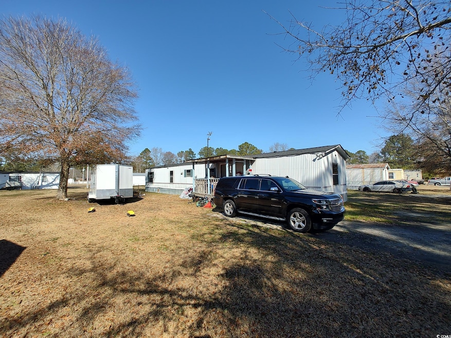 View of front of property featuring a front lawn