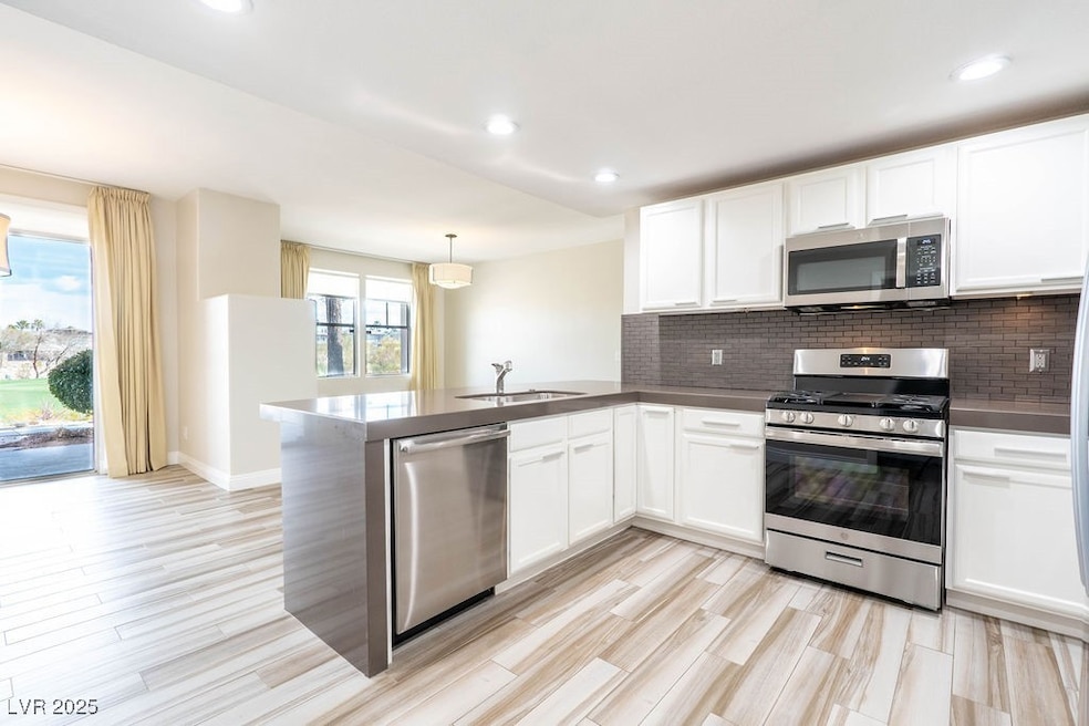 Kitchen featuring Quartz countertops, stainless st