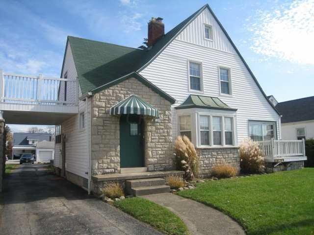 Front of home with two different balconi