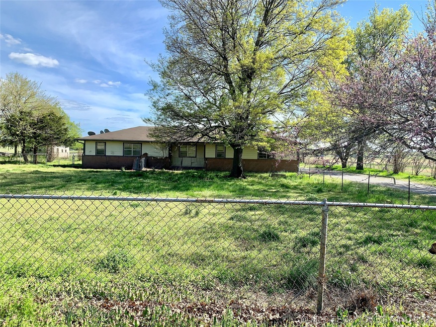 Front of house with fenced yard