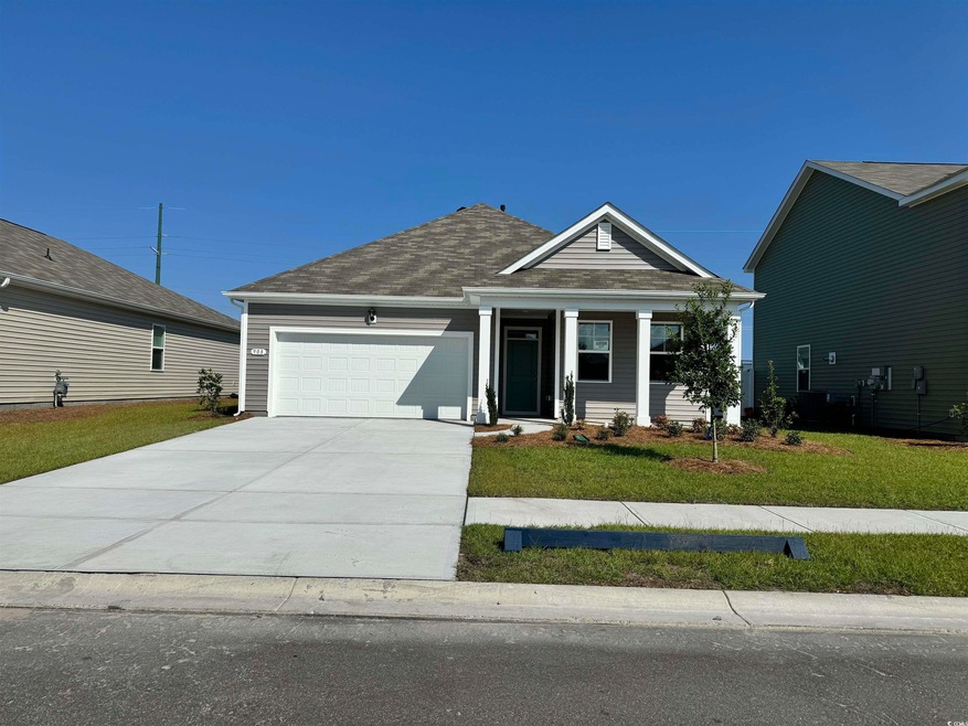 View of front facade featuring a front lawn and a 