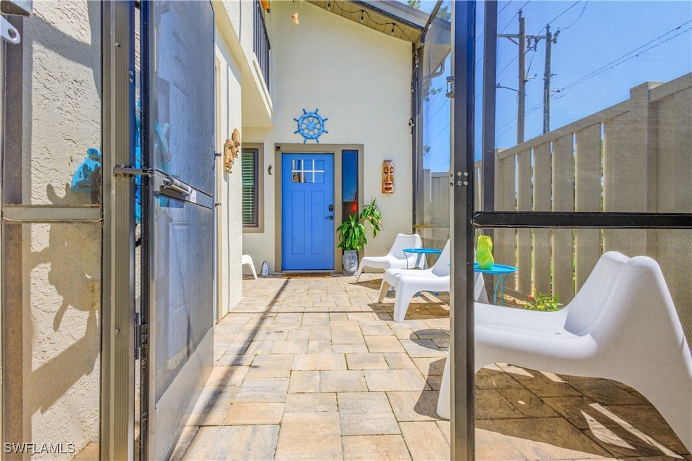Enter through a large screened-in, gated lanai. (U