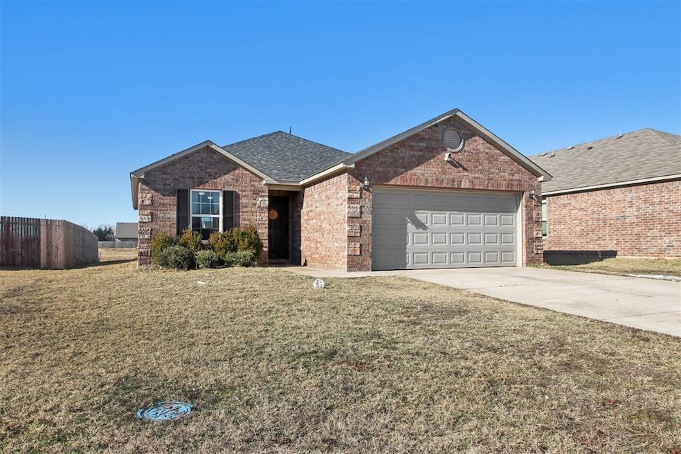 View of front of property with a garage and a fron