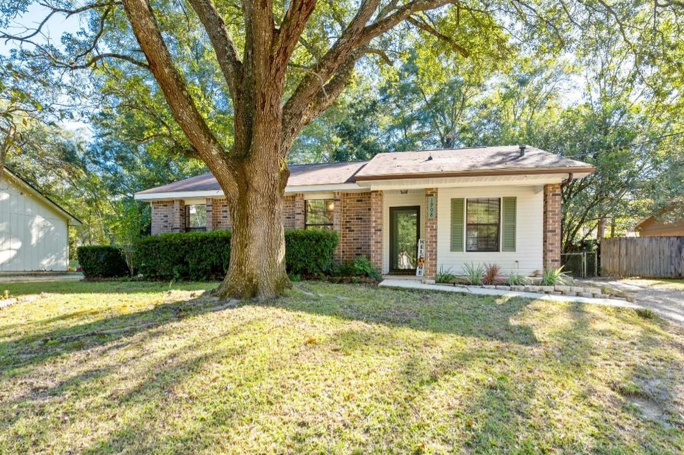 Ranch-style home with a front lawn