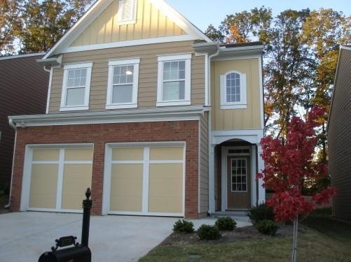 View of front of property featuring a garage