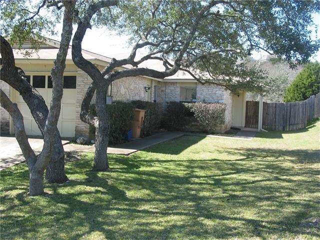 Nice tree shaded yard accents the duplex.