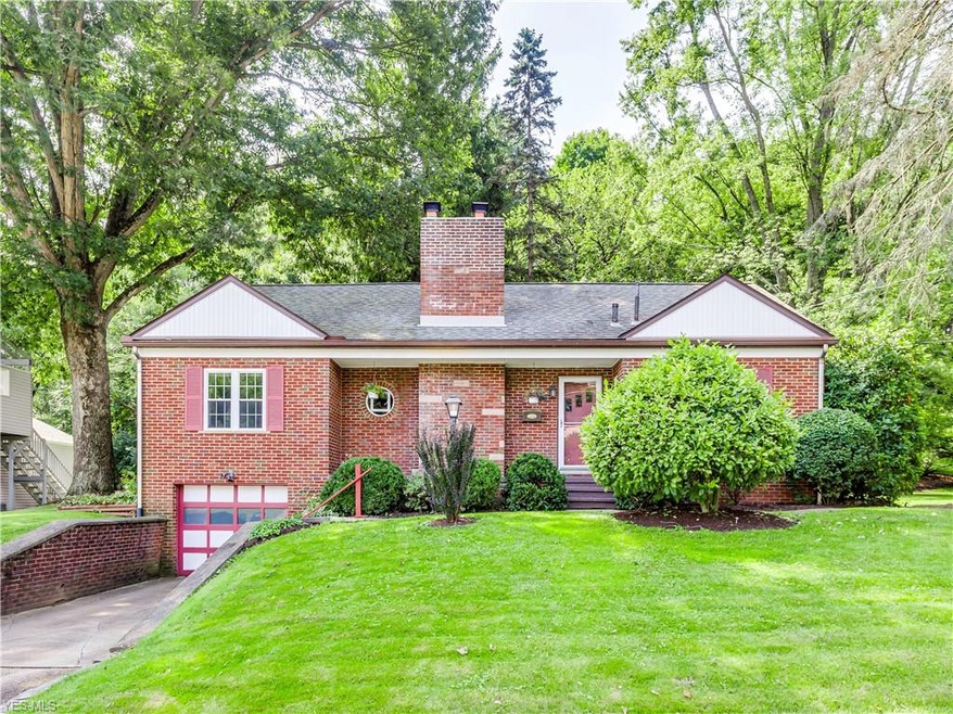 All brick bungalow sits on almost a half acre in t