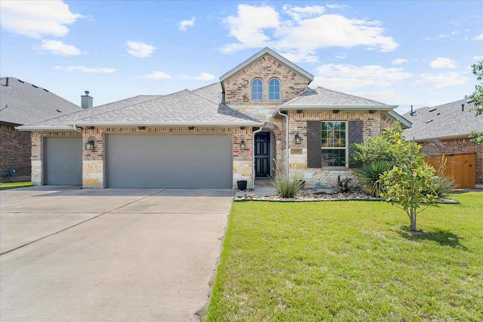 French country home featuring an attached garage,