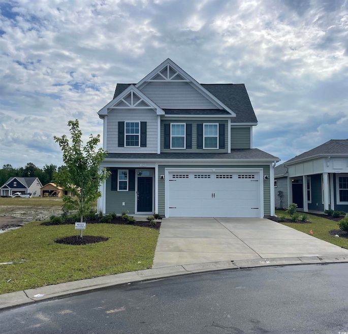 Craftsman inspired home with driveway, an attached