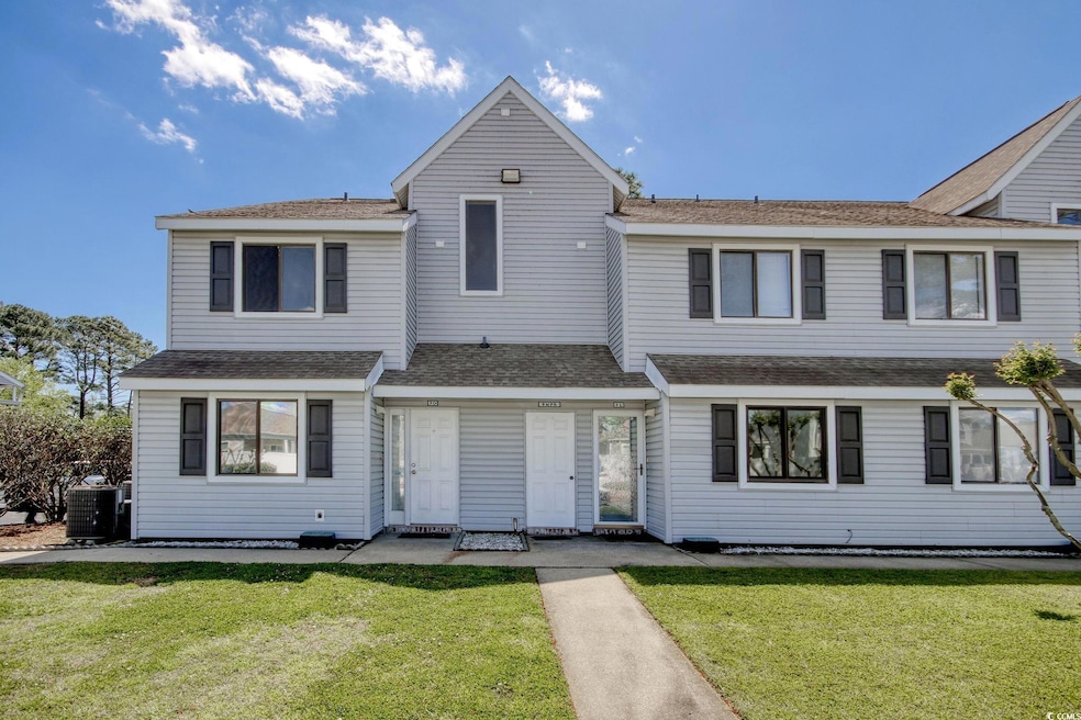 View of front of home featuring central AC and a f