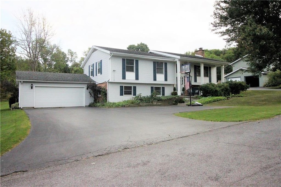 Front of house showing attached two car garage plu