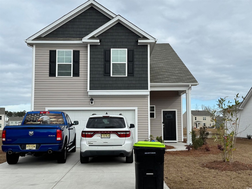 View of front of property with a garage