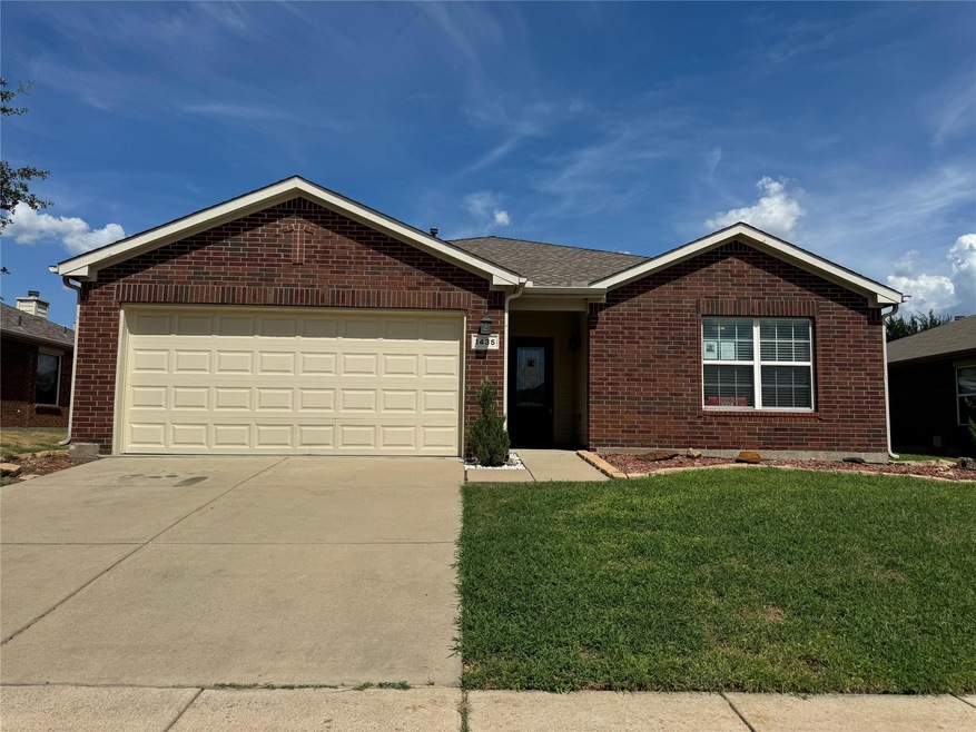Ranch-style house with a garage and a front yard