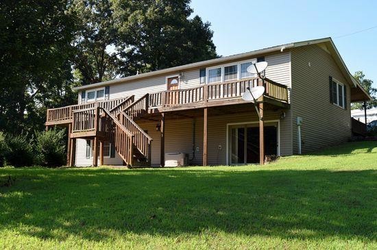 Front of House with full length Deck and Walk-out Basement Entrance.