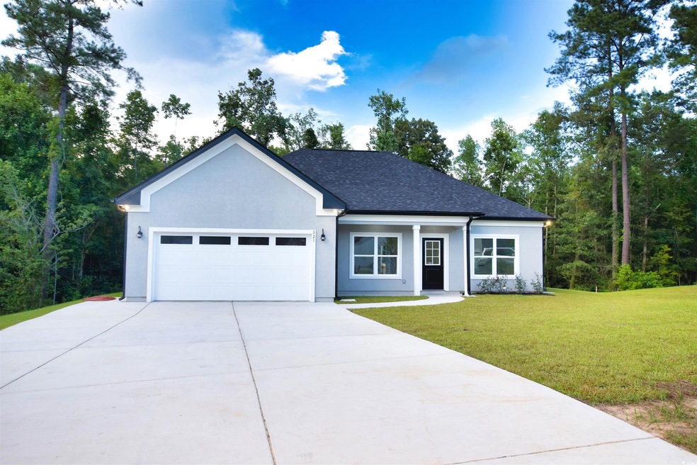 View of front of property with a garage and a fron