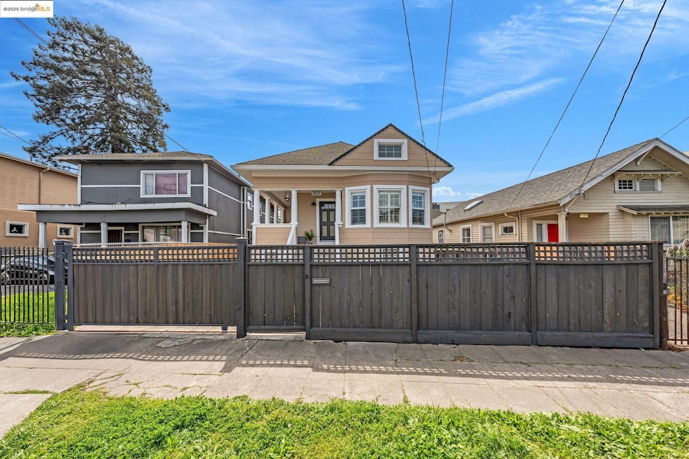 View of front of house featuring a fenced front yard and a gate