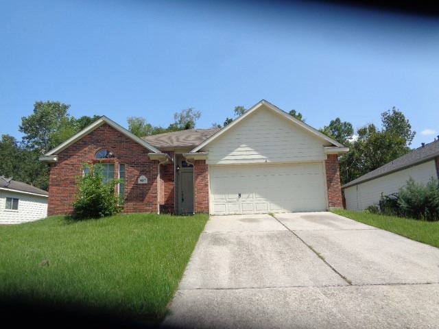 9807 Woodhollow Dr, Conroe, TX 77385 - photo 1