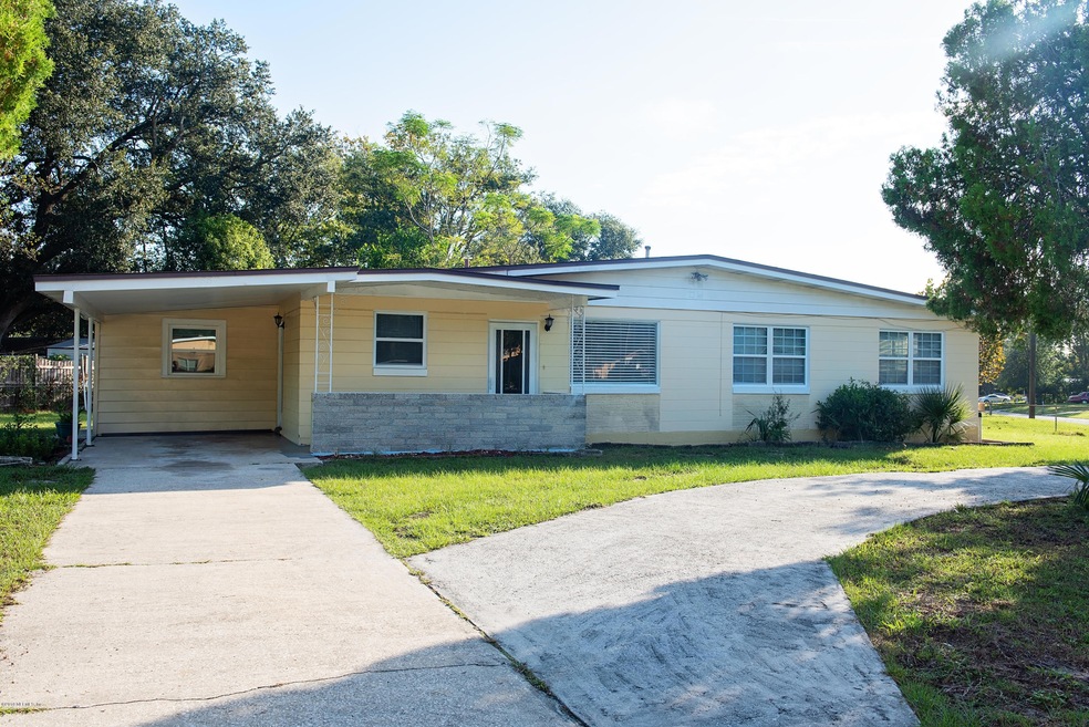 6887 Snow White Dr, Jacksonville, FL 32210 - photo 1