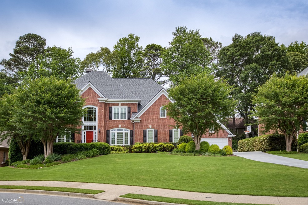 Beautiful 3 sided Brick Traditional with 4 car gar