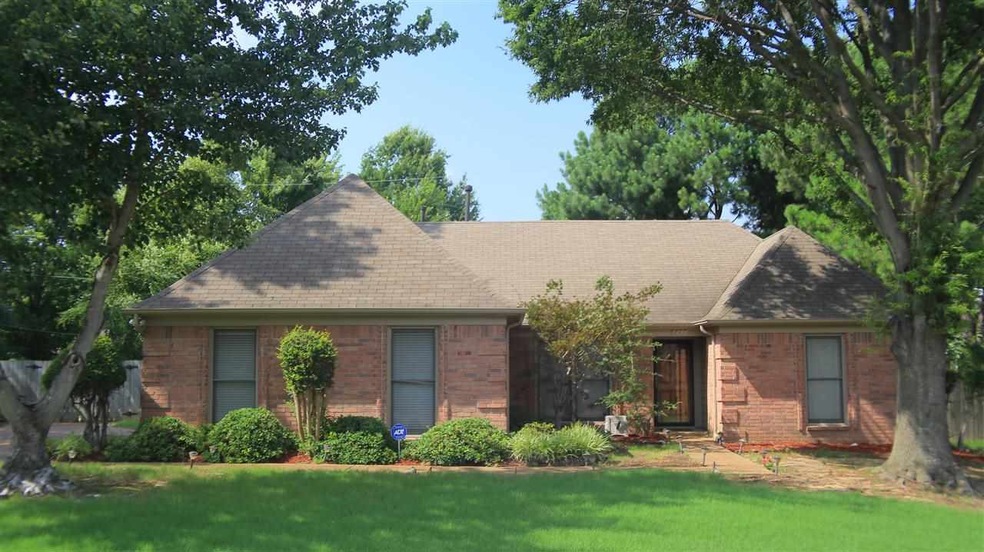 This large cove lot is home to this 3 Bedroom, 2 B