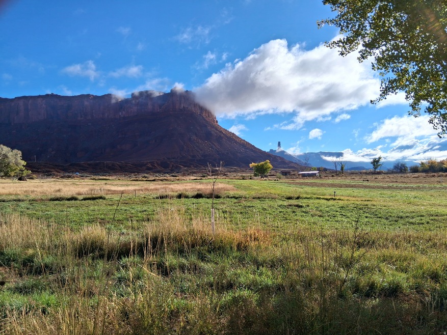View of mountain backdrop with rural landscape