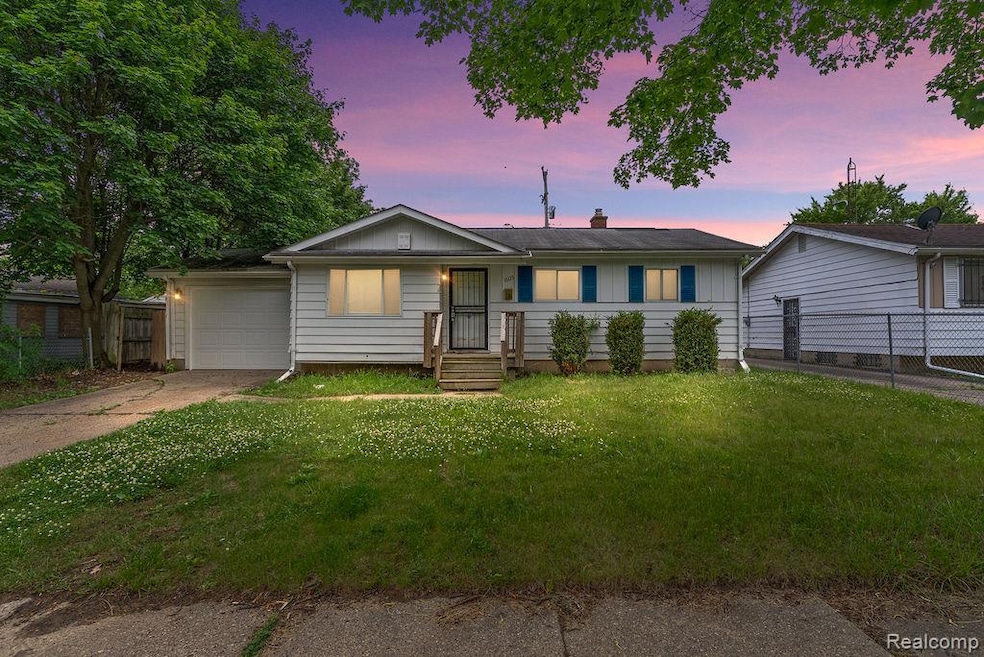 Single story home with a chimney, concrete driveway, board and batten siding, and an attached garage