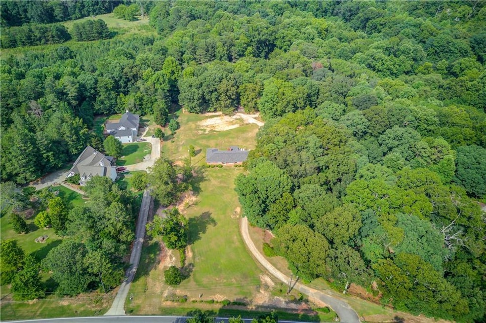 This charming 4 bedroom ranch sits on over 8+ acre