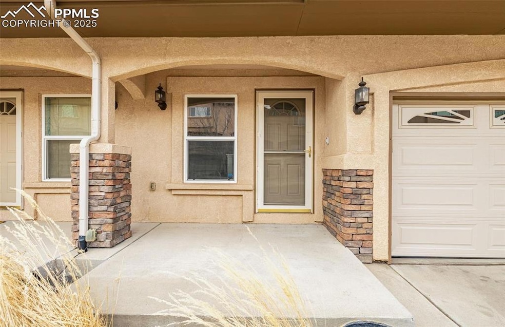 Property entrance with a garage