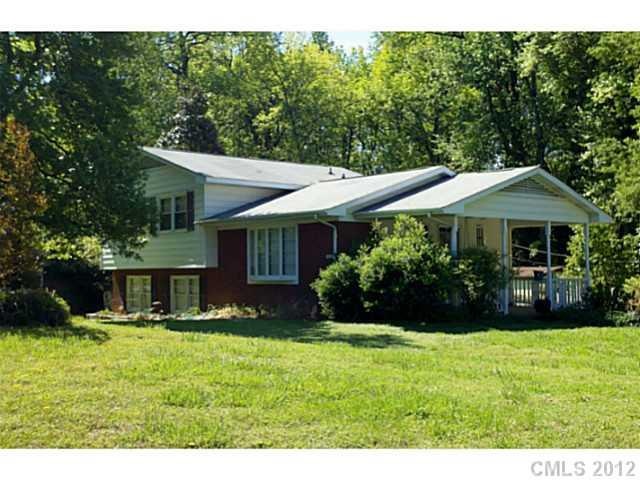 Exterior Front - Large corner lot with fenced yard