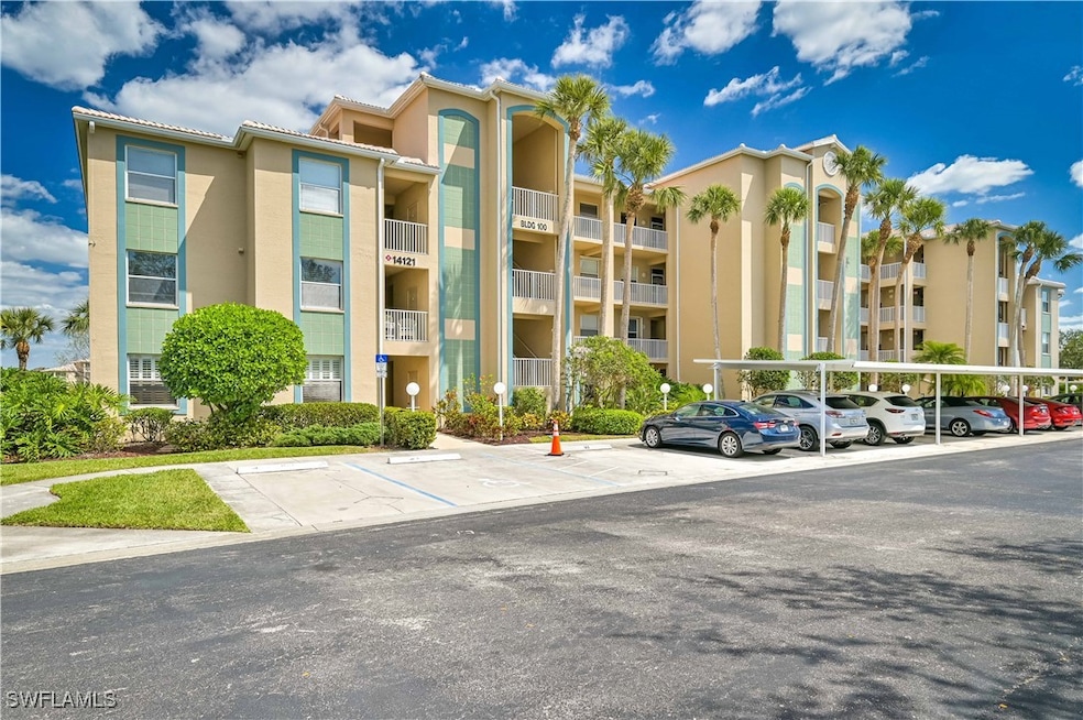 View of apartment building / complex featuring cov