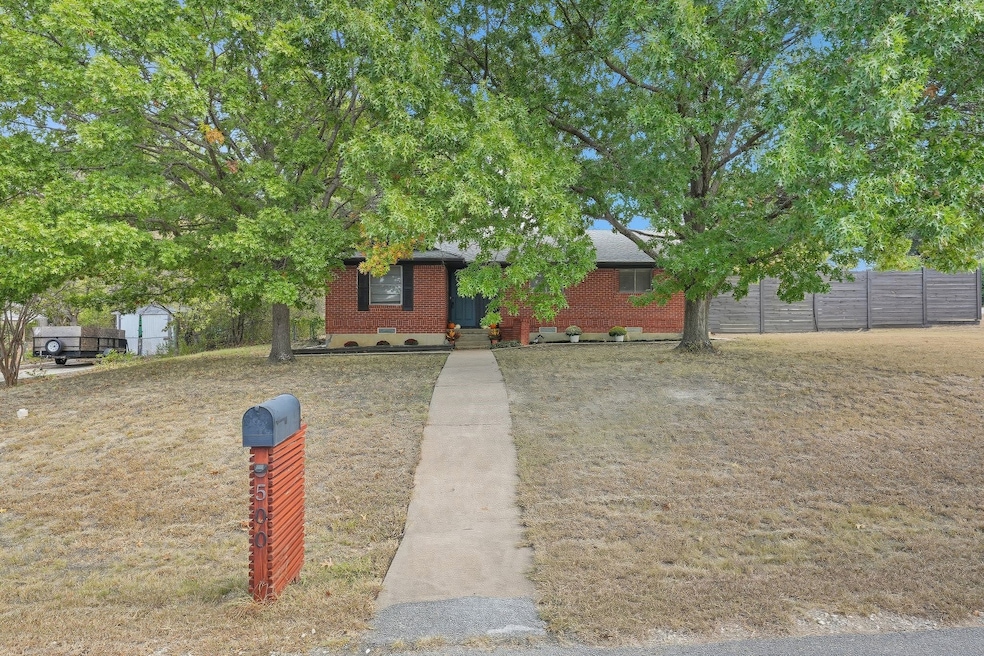 View of front of home featuring brick siding