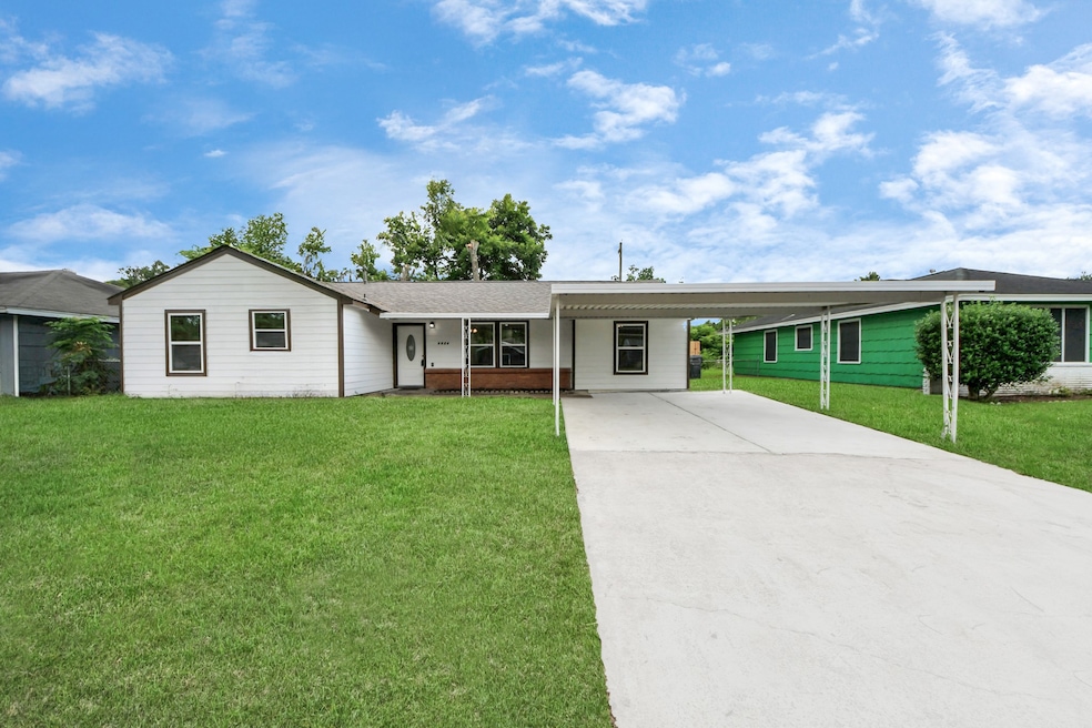 This is a charming single-story home with a white