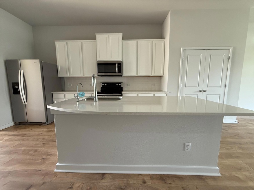 Kitchen featuring appliances with stainless steel