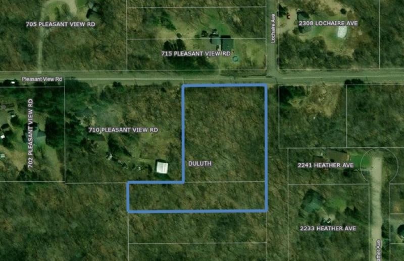 Aerial overview of property's location with property parcel outlined