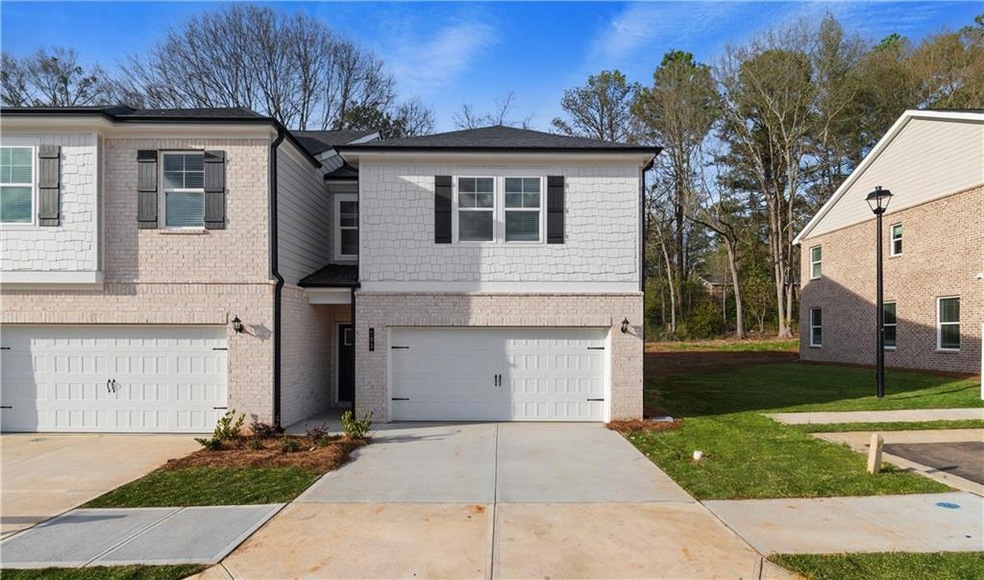 View of front of property with a garage and a fron