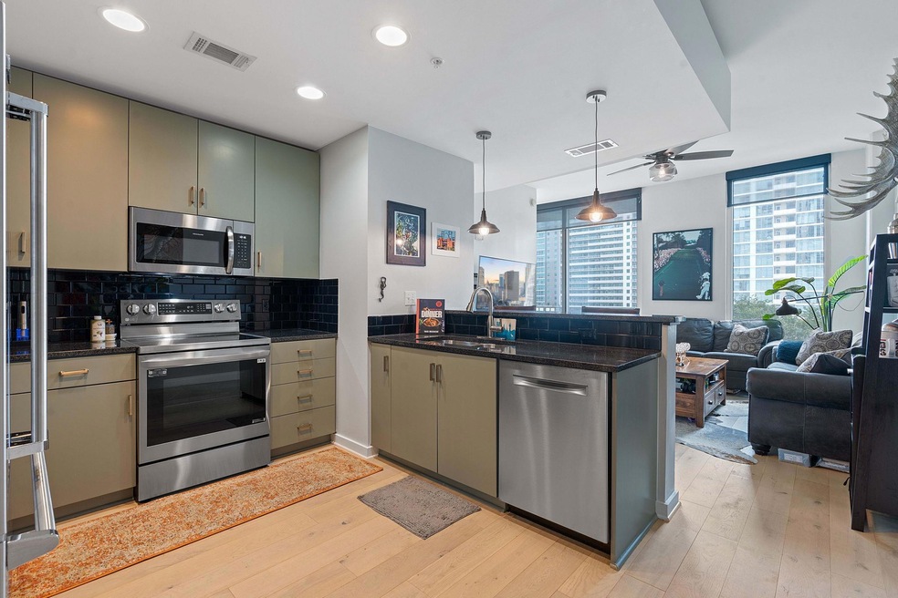 Kitchen with visible vents, decorative backsplash
