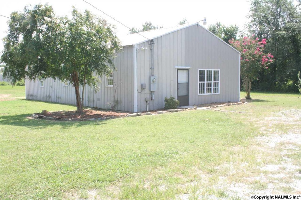 1500 sq ft. 4 bedroom 2 bath home. This is a metal construction built in approx. 2001,  the interior was converted in 2015.