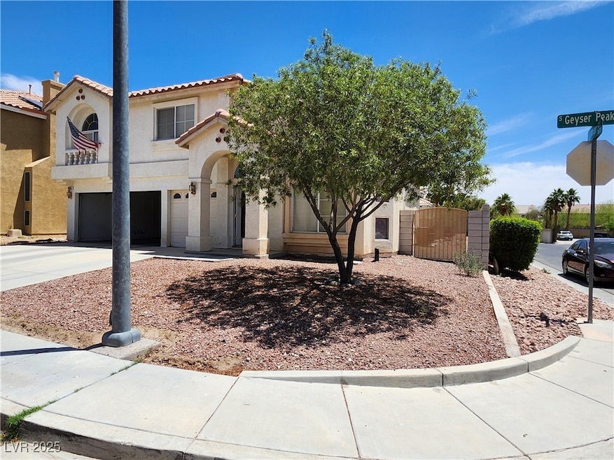 View of front of property featuring a gate, stucco