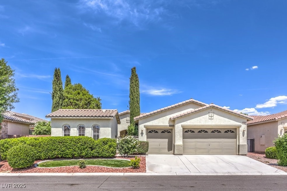 Mediterranean / spanish home with a garage, stucco