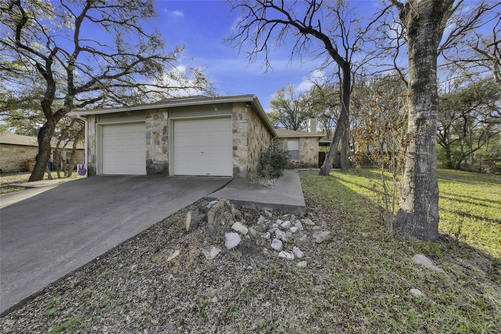 View of home's exterior featuring stone siding, c