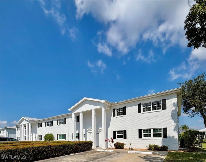 View of front of property featuring uncovered park
