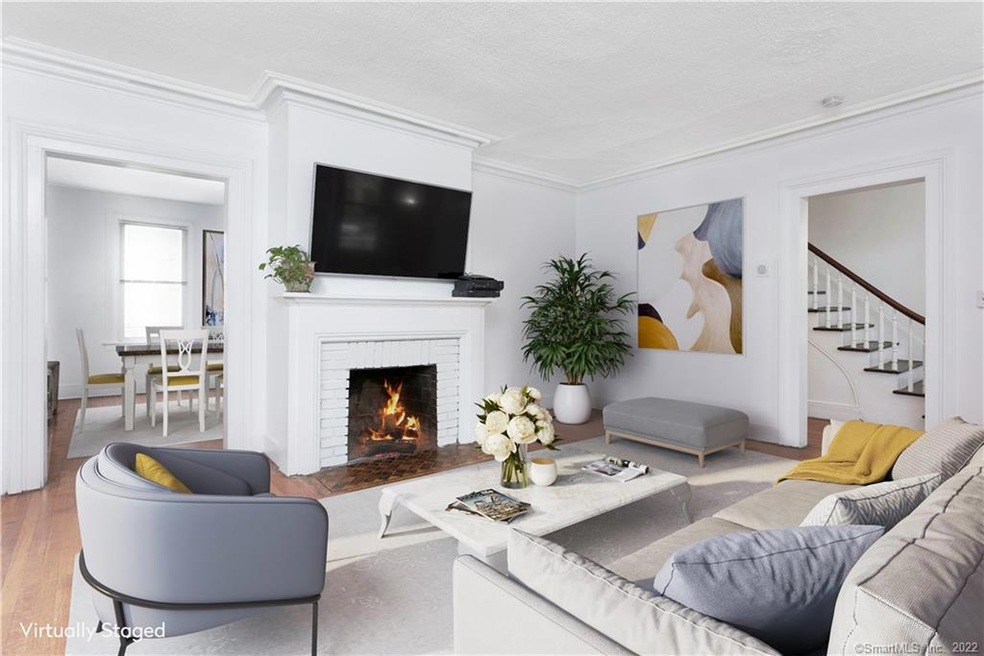 Large Living Room with fireplace opens to dining r
