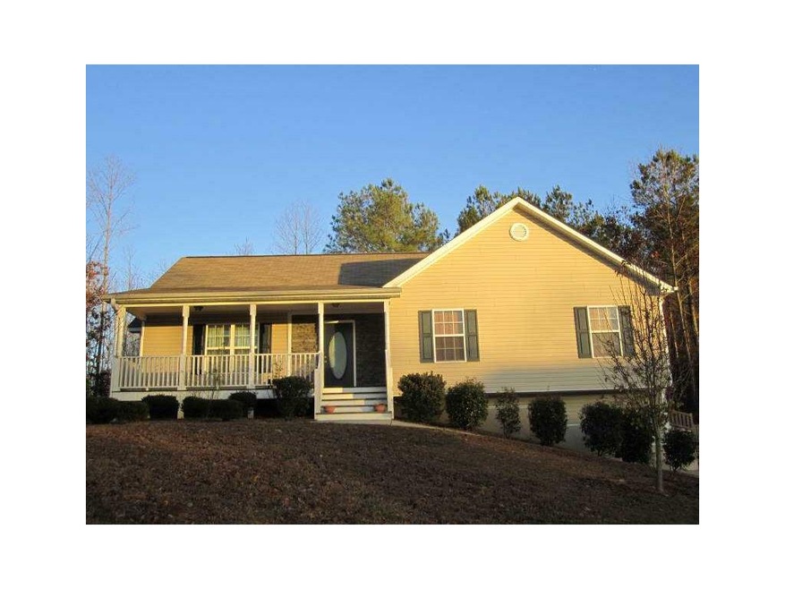 Exterior Front. The home sits on a gentle slope ni