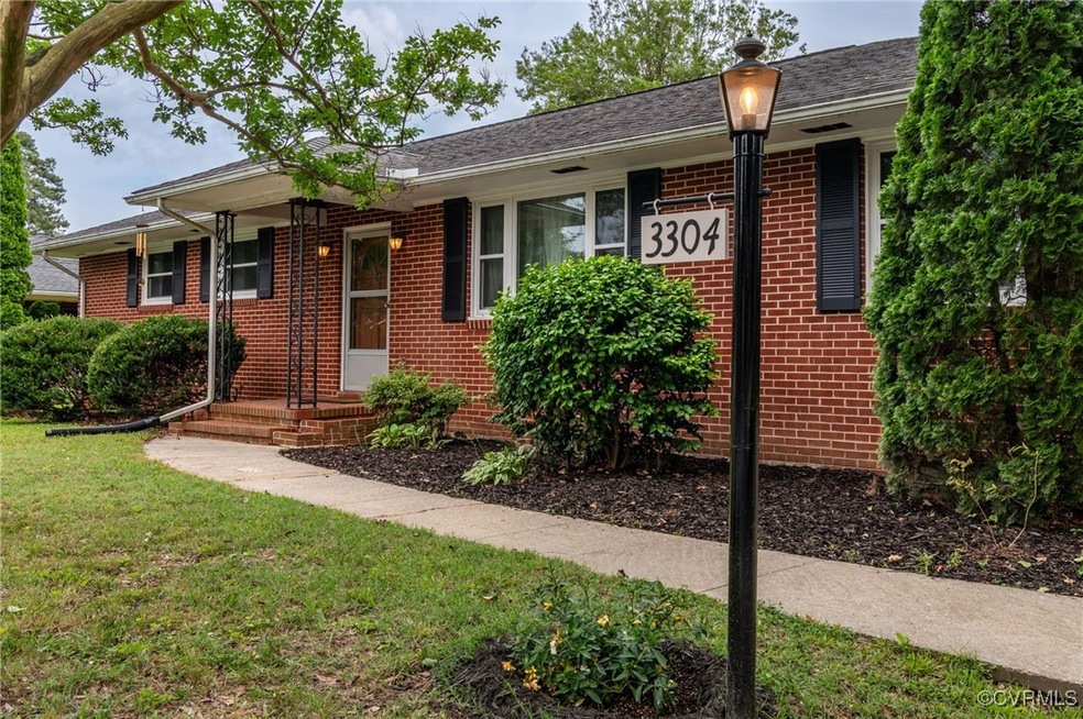 Ranch-style house with brick siding and a front la