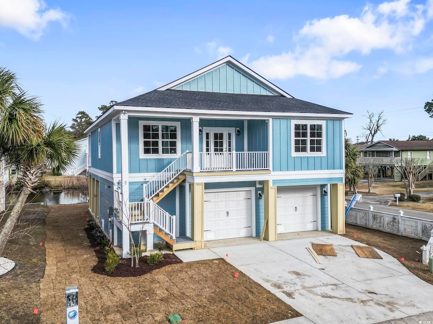 Coastal home featuring a garage