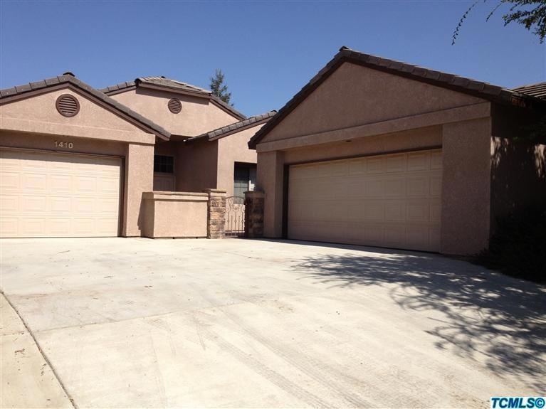 Split 3 car garage, courtyard entrance t