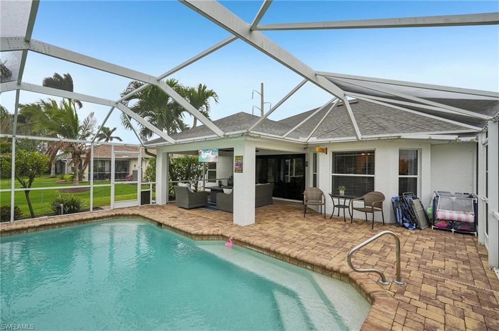 Swimming pool featuring a patio, outdoor lounge area, and a lanai