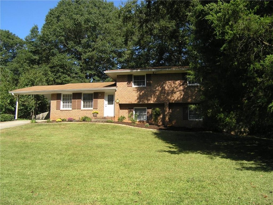 This brick beauty is ideal place to call home!